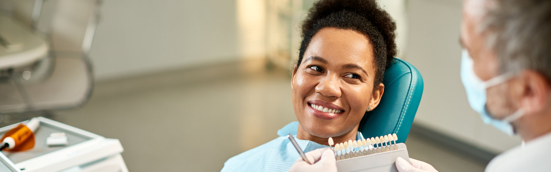 Smiling woman in front of doctor