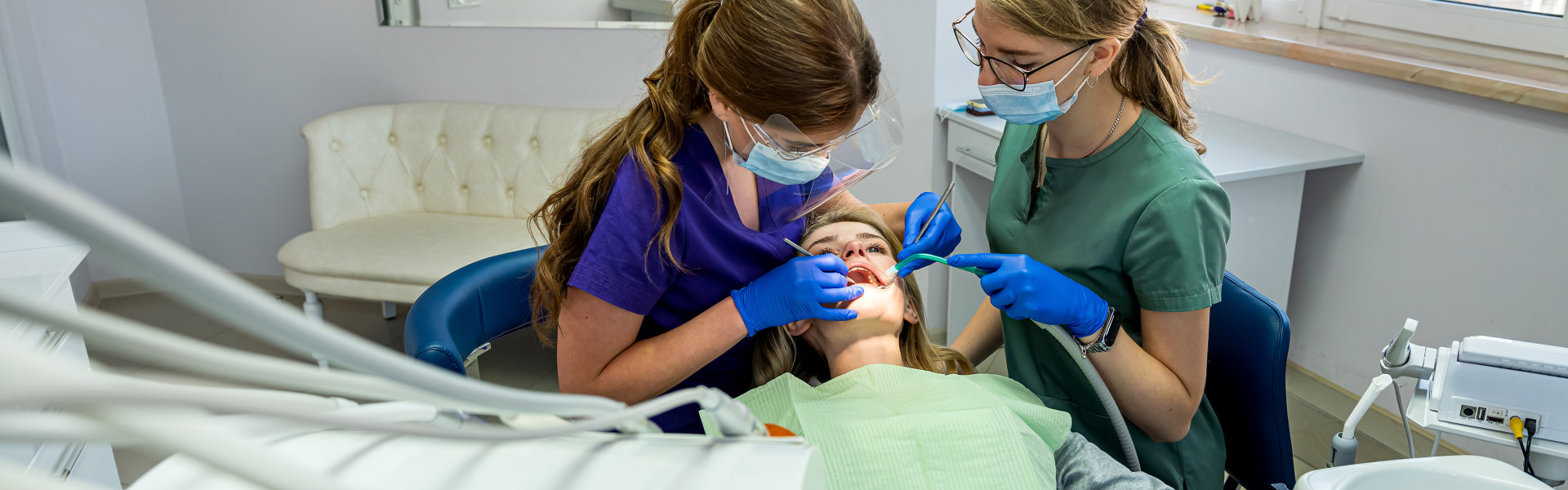 Dentist removing teeth of patient