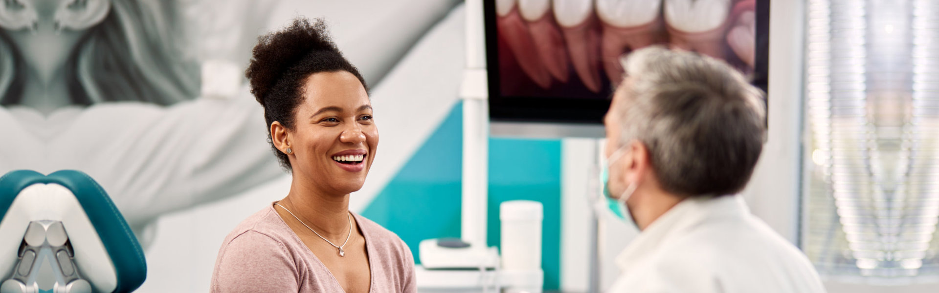 smiling woman and a dentist portrait